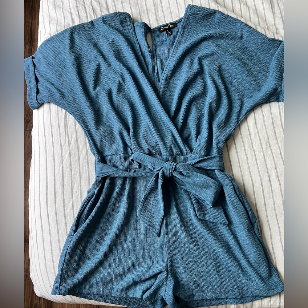 Cute summery blue romper with tie front. Very flattering.